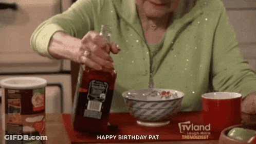 A Woman Is Pouring Ketchup Into A Bowl While Sitting At A Table . GIF