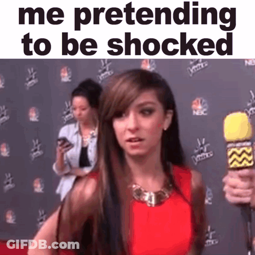 A Woman Is Pretending To Be Shocked While Holding A Microphone . GIF
