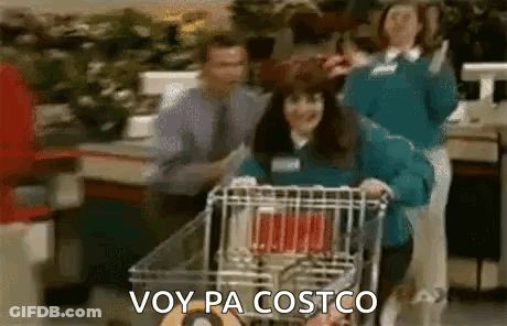 A Woman Is Pushing A Shopping Cart In A Grocery Store And Says `` Voy Pa Costco '' . GIF