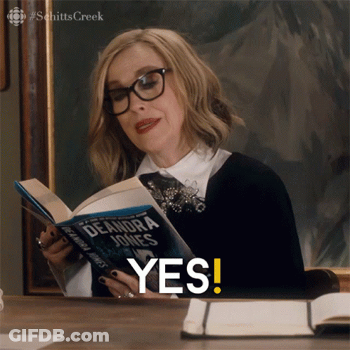 A Woman Is Reading A Book By Deandra Jones GIF