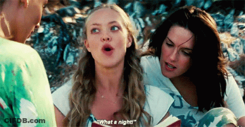 A Woman Is Reading A Book To Two Other Women While One Of Them Says What A Night . GIF