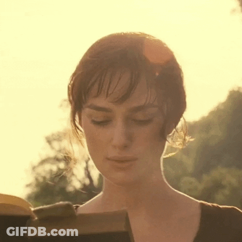 A Woman Is Reading A Book With Her Eyes Closed . GIF