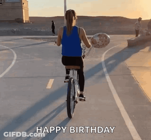 A Woman Is Riding A Bike While Holding A Balloon And The Words Happy Birthday Are Written On The Bottom GIF