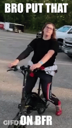 Woman Riding Electric Scooter On Street GIF