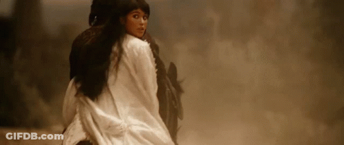 A Woman Is Riding On The Back Of A Horse . GIF