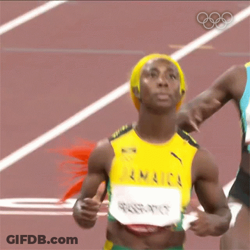 A Woman Is Running On A Track Wearing A Jamaica Jersey GIF
