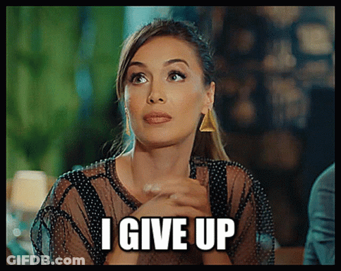 A Woman Is Saying I Give Up With Her Hands Folded In Front Of Her Face GIF