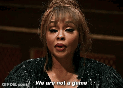A Woman Is Saying We Are Not A Game In A Dark Room . GIF