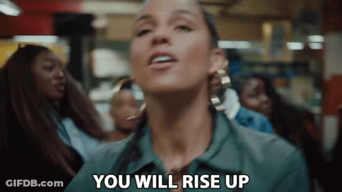 A Woman Is Saying `` You Will Rise Up '' In Front Of A Crowd . GIF