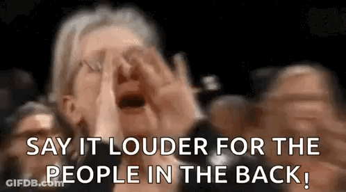 A Woman Is Screaming In A Crowd Of People While Saying `` Say It Louder For The People In The Back '' . GIF