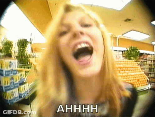 A Woman Is Screaming In A Grocery Store With The Word Ahhhh Above Her GIF