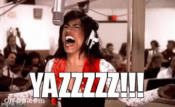 A Woman Is Screaming Into A Microphone While Wearing Headphones And A Red Shirt . GIF