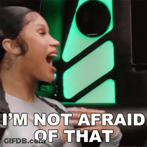 A Woman Is Screaming With Her Mouth Open And Says `` I 'M Not Afraid Of That '' . GIF