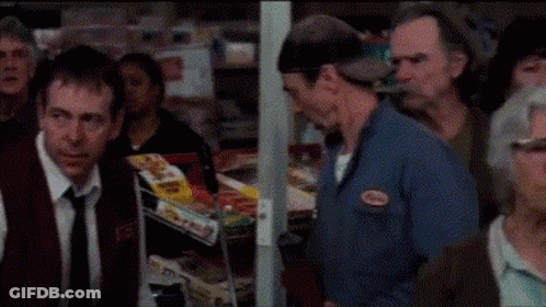 A Woman Is Screaming With Her Mouth Open GIF