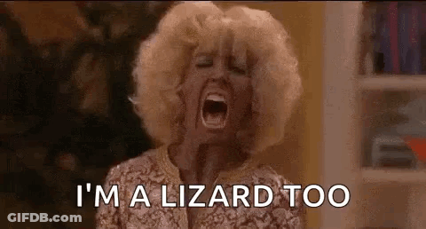 A Woman Is Screaming With Her Mouth Wide Open And The Words `` I 'M A Lizard Too '' . GIF