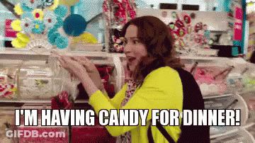 A Woman Is Shopping For Candy In A Store And Says `` I 'M Having Candy For Dinner '' GIF