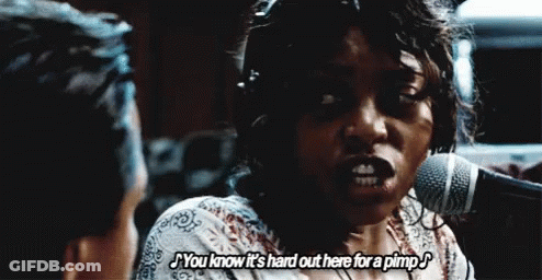 A Woman Is Singing Into A Microphone And Saying You Know It 'S Hard Out Here For A Pimp GIF