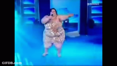 A Woman Is Singing Into A Microphone On A Stage With A Blue Background That Says ' Guigui ' On It GIF