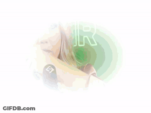 A Woman Is Singing Into A Microphone With The Letter S On It GIF