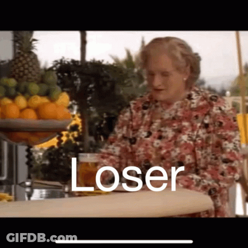A Woman Is Sitting At A Bar Holding A Glass Of Beer And The Word Loser Is Written On The Screen . GIF