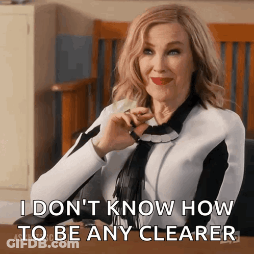 A Woman Is Sitting At A Desk And Says " I Don 'T Know How To Be Any Clearer " GIF