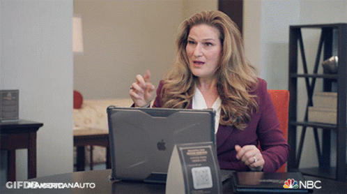 Woman At Desk With Americanauto Sign GIF