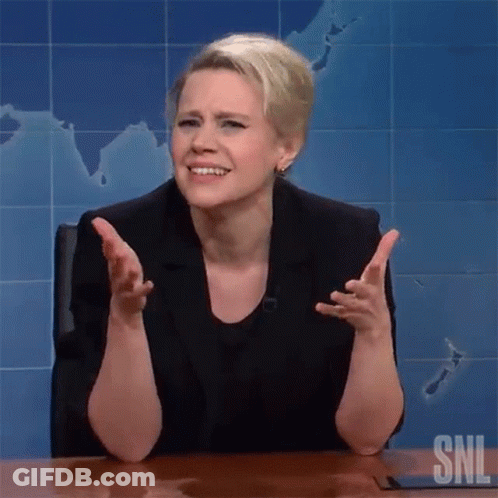 A Woman Is Sitting At A Desk With Her Arms Outstretched In Front Of A Map On The Wall . GIF