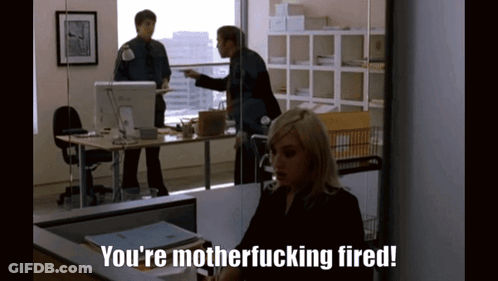 A Woman Is Sitting At A Desk With The Words You 'Re Motherfucking Fired GIF