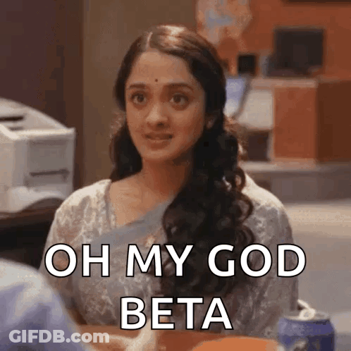 A Woman Is Sitting At A Table And Says Oh My God Beta GIF