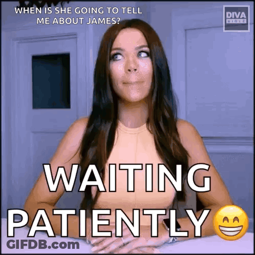 A Woman Is Sitting At A Table Waiting Patiently For Someone To Tell Her About James . GIF
