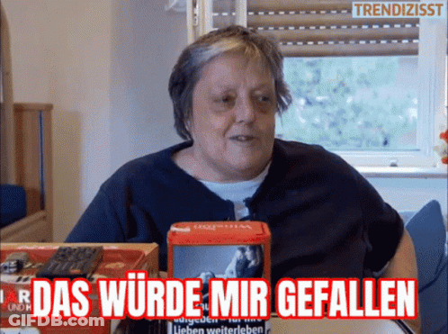 Woman Sitting At Table With Das Wurde Mir Gefallen Box GIF