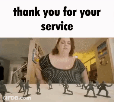 A Woman Is Sitting At A Table With A Bunch Of Toy Soldiers In Front Of Her . GIF