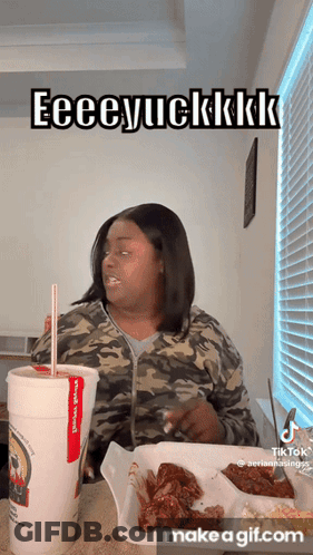 A Woman Is Sitting At A Table With A Cup Of Soda And A Tray Of Food And Says Eeeeyuckkkk GIF