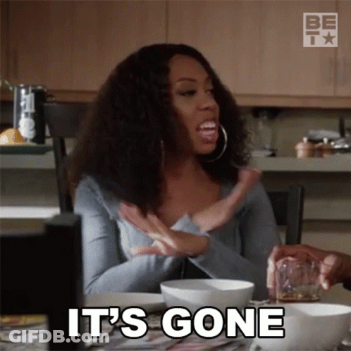 A Woman Is Sitting At A Table With A Glass Of Whiskey And A Bowl Of Food And Says It 'S Gone GIF