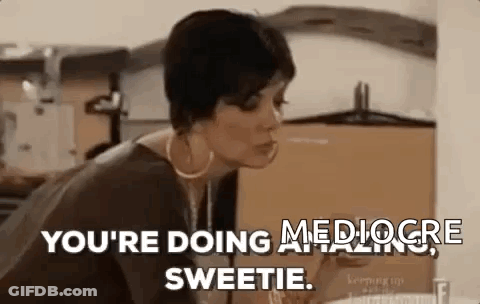 A Woman Is Sitting At A Table With A Glass Of Wine In Her Hand . GIF