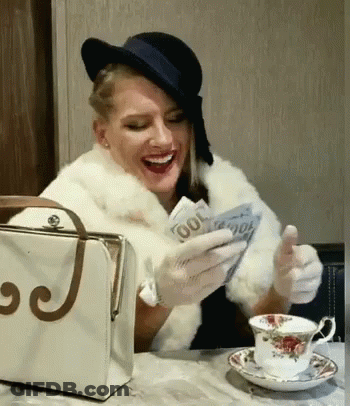 Woman Sitting At Table With J Purse GIF
