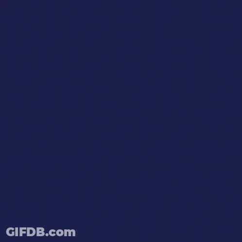 A Woman Is Sitting At A Table With Her Eyes Closed Talking On A Cell Phone . GIF
