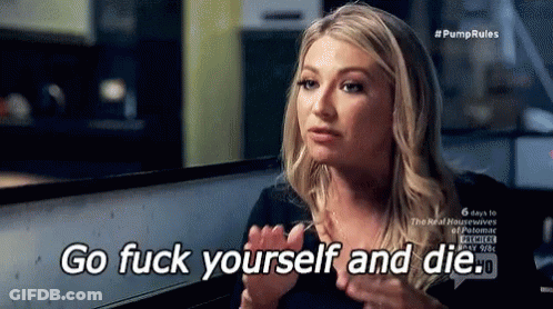 A Woman Is Sitting At A Table With Her Hands Up And Says Go Fuck Yourself And Die . GIF