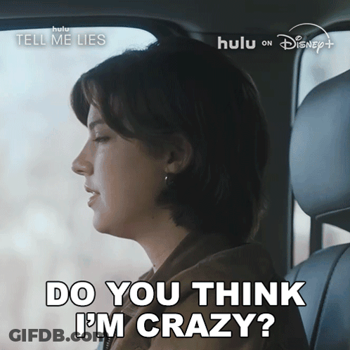 A Woman Is Sitting In A Car With The Words Do You Think I 'M Crazy GIF