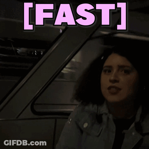 A Woman Is Sitting In A Car With The Words Fast Behind Her GIF