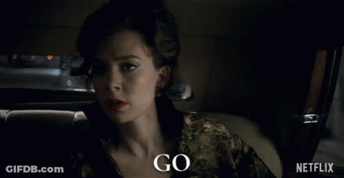 A Woman Is Sitting In A Car With The Words Go Written On The Bottom GIF
