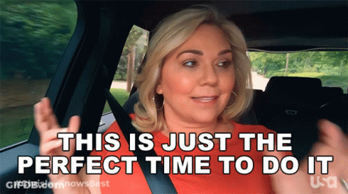 A Woman Is Sitting In A Car With The Words " This Is Just The Perfect Time To Do It " GIF