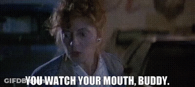 A Woman Is Sitting In A Car With The Words `` You Watch Your Mouth , Buddy '' Written On The Screen . GIF