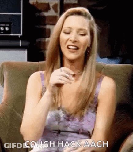 A Woman Is Sitting In A Chair And Laughing . GIF