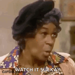 A Woman Is Sitting In A Chair And Talking To Another Woman . GIF
