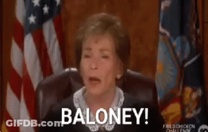 A Woman Is Sitting In A Chair In Front Of An American Flag And Saying Baloney . GIF