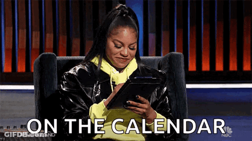A Woman Is Sitting In A Chair Looking At A Tablet And The Words On The Calendar Are Visible . GIF