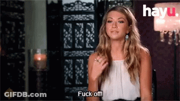 A Woman Is Sitting In A Chair Saying Fuck Off GIF