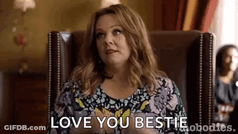 A Woman Is Sitting In A Chair Saying `` I Love You Bestie '' . GIF