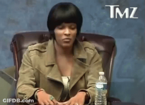 A Woman Is Sitting In A Chair With A Bottle Of Water In Front Of Her And The Word Tmz On The Bottom GIF